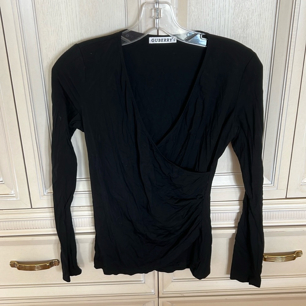 Super soft black top with super flattering detail. Lightweight